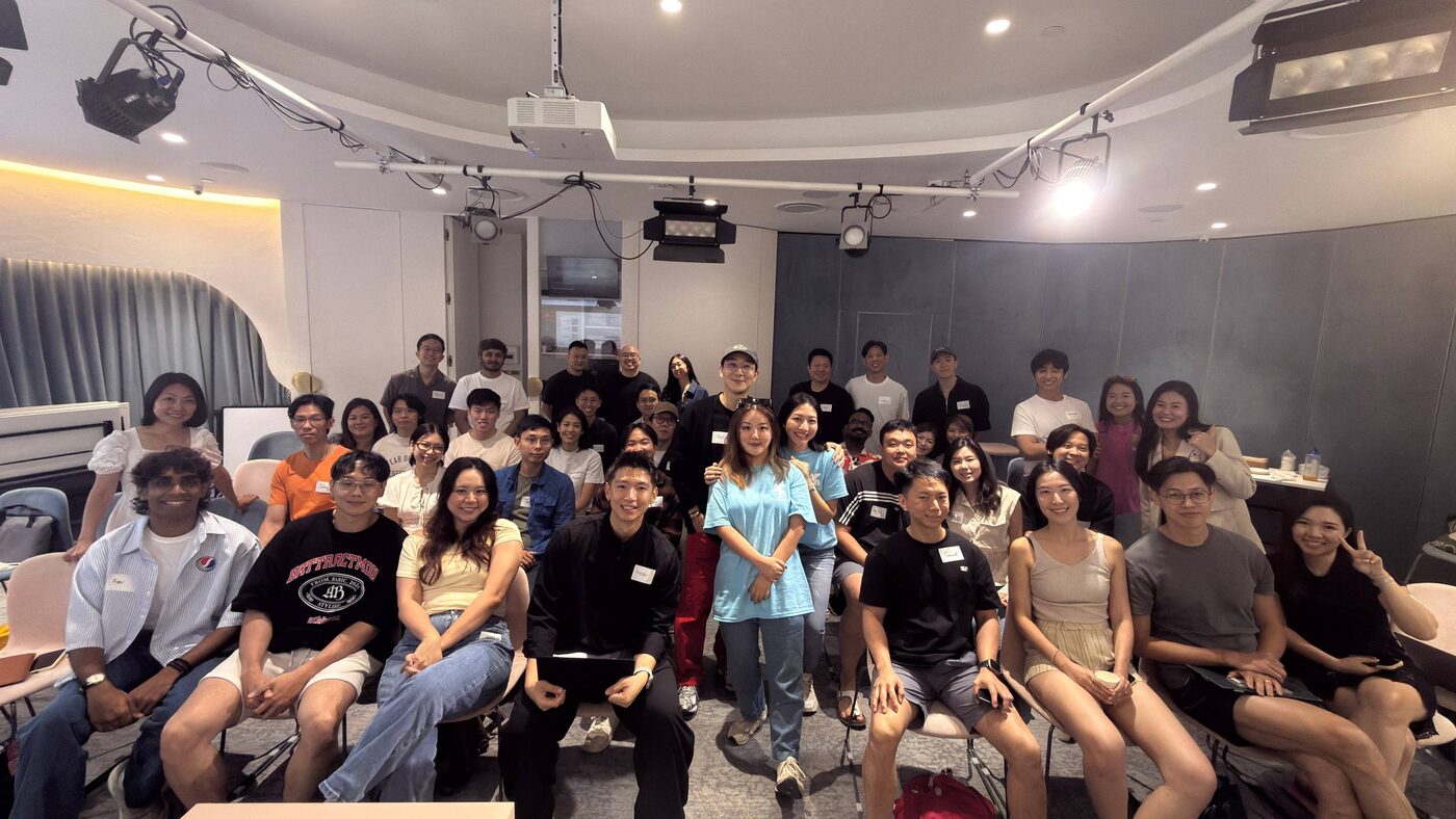 Demo Day #01 full room at Cuppage Road, 40+ builders, The AI Burrow × first AIde, 25 July 2026